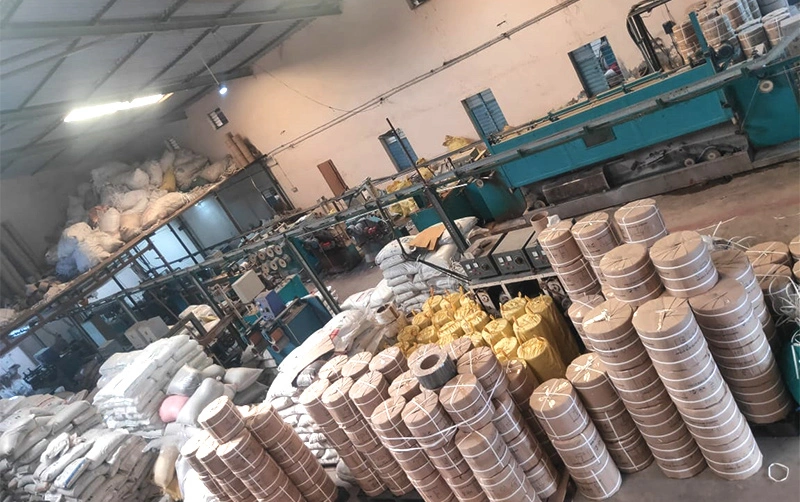 Factory overview showing multiple strapping machines in operation